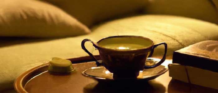 cup of matcha on a night stand